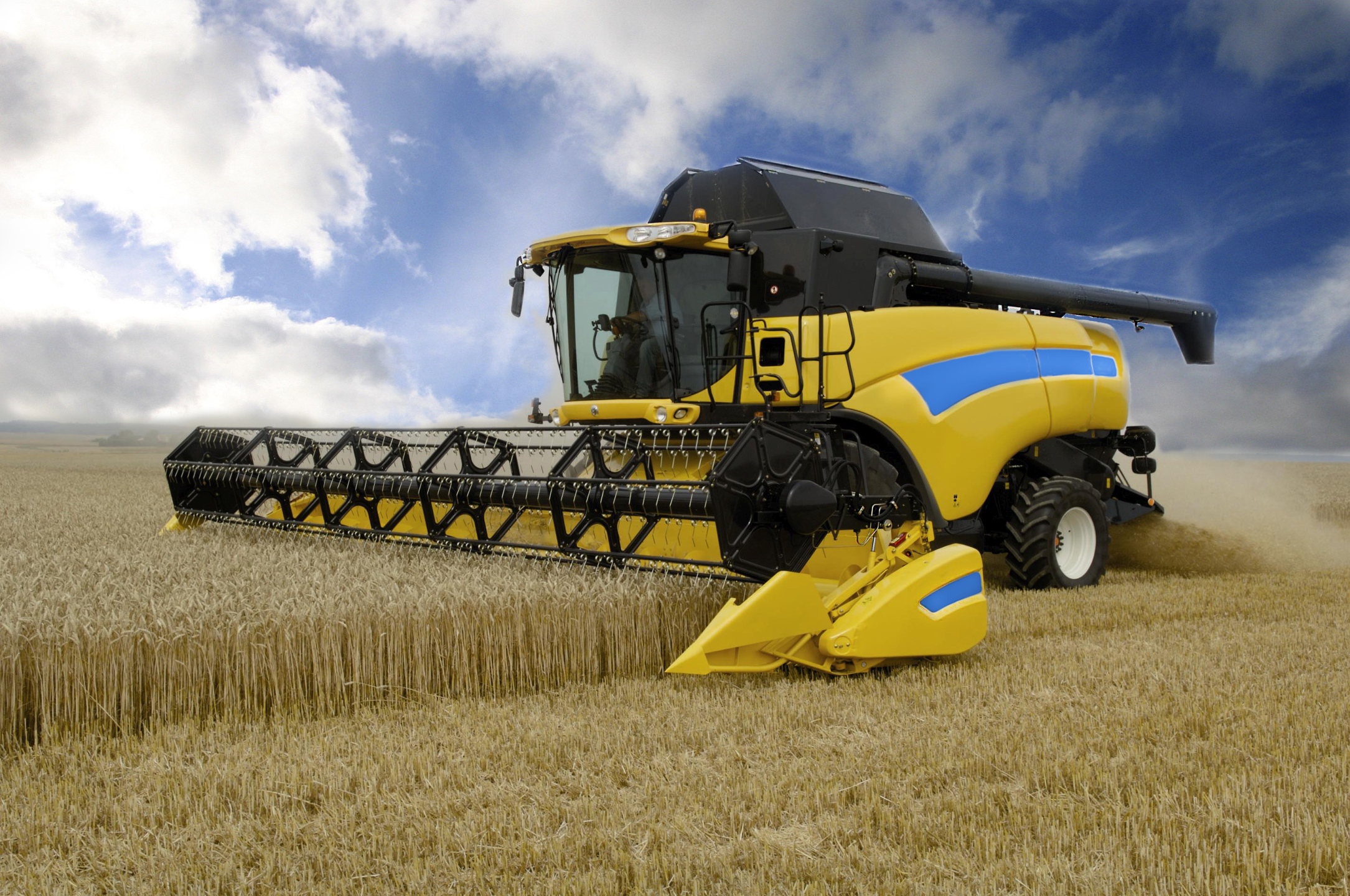 New holland cx. Зерноуборочный комбайн Нью Холланд. Комбайн Нью Холланд CR 9080 на уборке. Комбайн Нью Холланд СХ 6.90. Нью Холланд комбайн производитель.